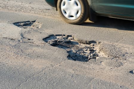 Why Timely Pothole Repair Saves Your Business Money
